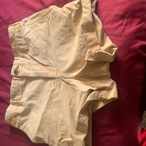 A pair of orange shorts